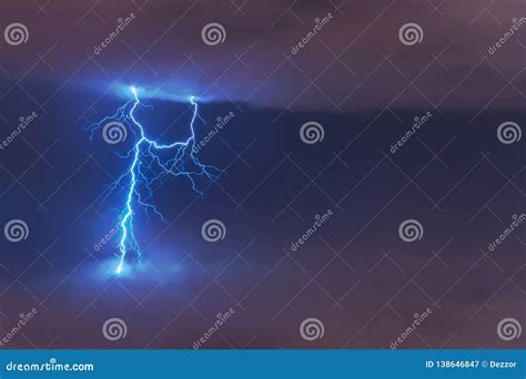 Lightning Strike Flash Electric Discharge Between Clouds At Night