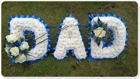 Top quality affordable flowers for funerals. Blue Dad Funeral Flower Tribute - Floral Exuberance