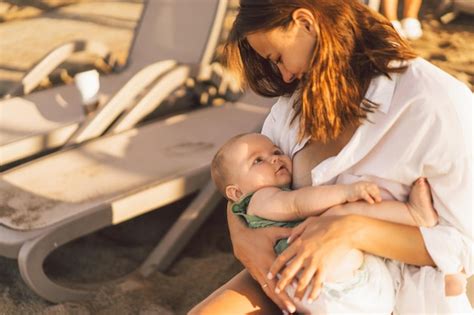 Premium Photo Newborn Baby Boy Sucking Milk From Mothers Breast On