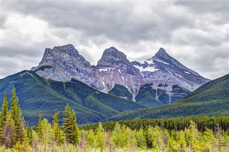 Three Sisters Mountain Peaks In The Canadian Rockies Of Canmore Alberta