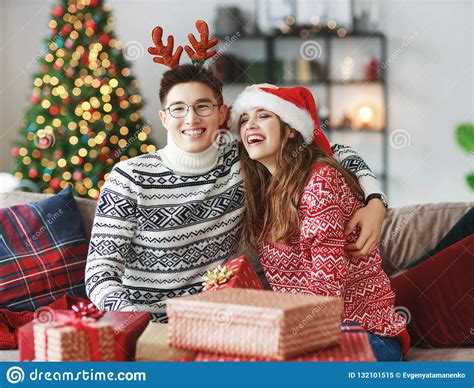 Search, discover and share your favorite young couples gifs. Couple Opening Presents On Christmas Morning Stock Image ...