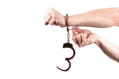 Hands In Handcuffs Free Stock Photo - Public Domain Pictures