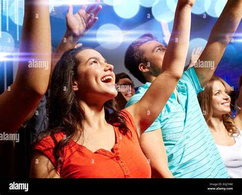 Smiling Friends At Concert In Club Stock Photo Alamy