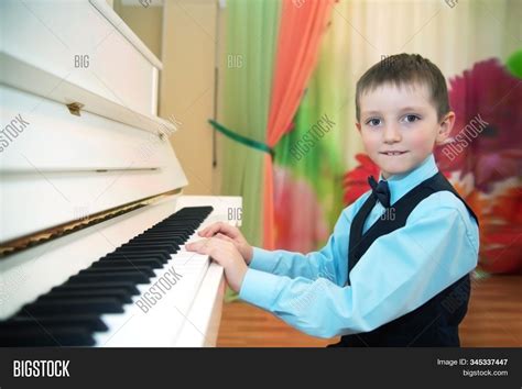 Little Boy Plays Piano Image And Photo Free Trial Bigstock