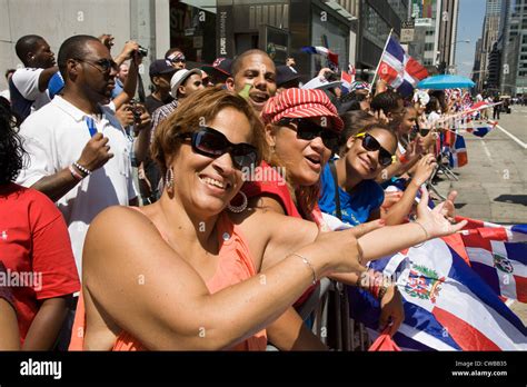 dominican new yorkers come out in large numbers to watch the dominican day parade along ave of