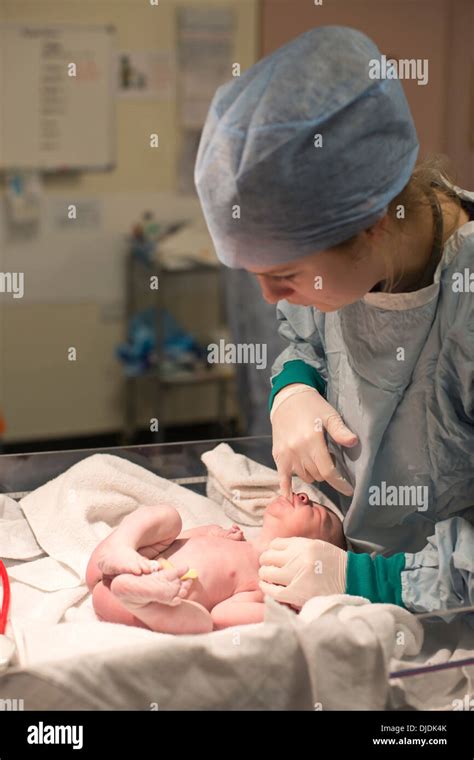 Newborn Baby Boy Having Palate Checked By Nurses In Hospital Maternity
