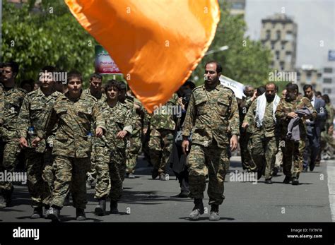 Members Of The Basij Militia Attend A Parade In Tehran Iran On April