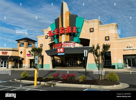 A Logo Sign Outside Of A Regal Cinemas Movie Theater Location In