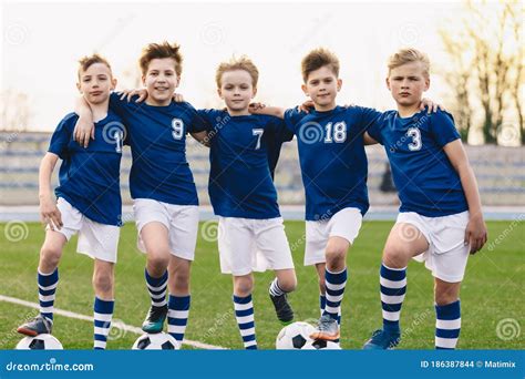 Young Boys In Soccer Team Happy Junior Sports Group Of Kids Stock