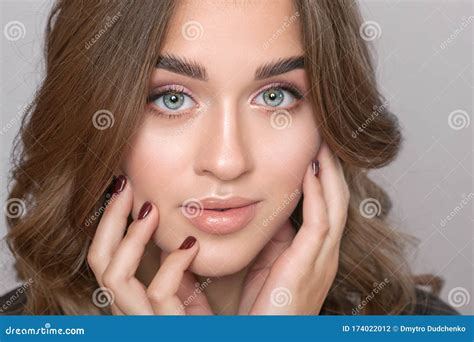 Portrait Of A Beautiful Woman With Fresh Nude Make Up Thick Eyebrows