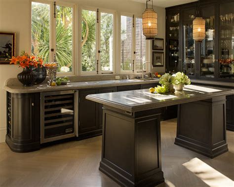 Black kitchen cabinets are tempered here with the light wood island and countertops. Dark Brown Cabinets | Houzz