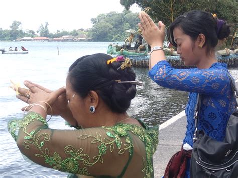 Praying To Dewi Danu Goddess Of The Waters Bali Indonesi Greg