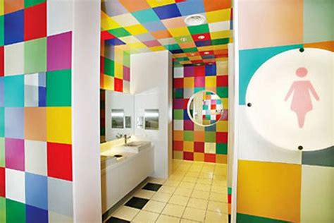The Bathroom Is Decorated With Multicolored Tiles And Has A Large