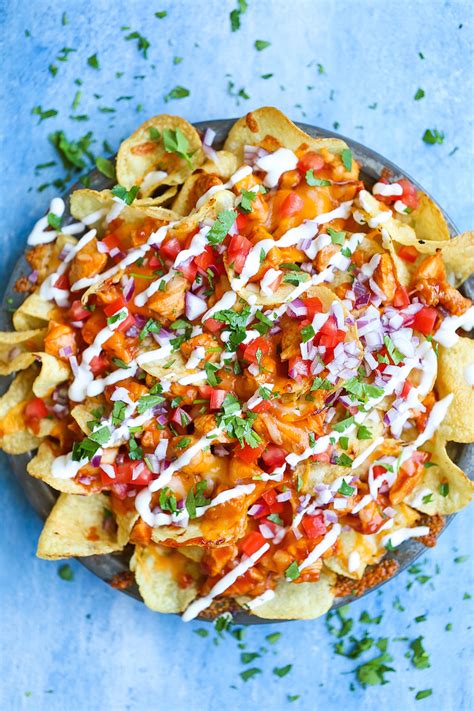 Layer up the tortilla chips in an ovenproof dish or baking tray with the chopped chicken, spring onions, cheese and pickled jalapeños. Loaded BBQ Chicken Nachos | Good Kitchen Blog