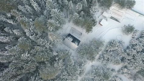 An Old Wooden Building In The Middle Of A Snowy Forest Concept Of