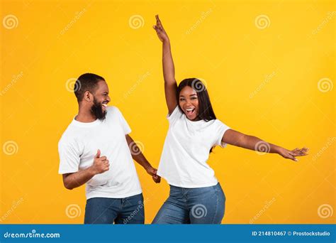 Portrait Of Emotional Black Couple Dancing At Studio Stock Image