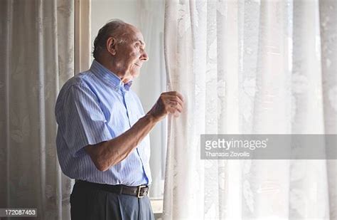 Old Man Look Out Window Photos And Premium High Res Pictures Getty Images