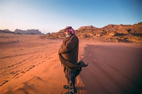 Download Arab Man Standing In Desert Wallpaper
