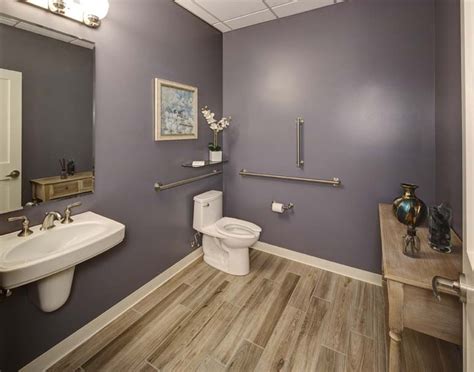As the small bathroom above shows, adding a mirror across a whole wall can double the look and feel of the room. New Millennium Medical - Chiropractic Office Design