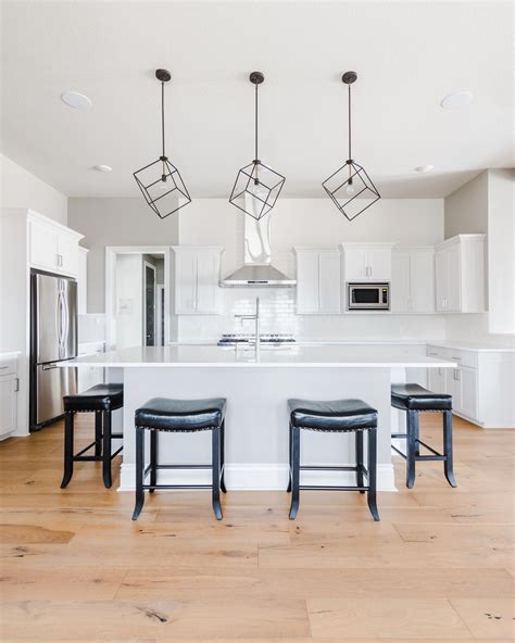 Modern White Kitchen With Traditional Accents Featuring Light European