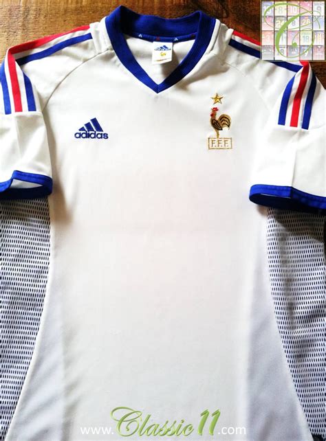 Manager, educator and father figure to french football. France Away football shirt 2002 - 2004.