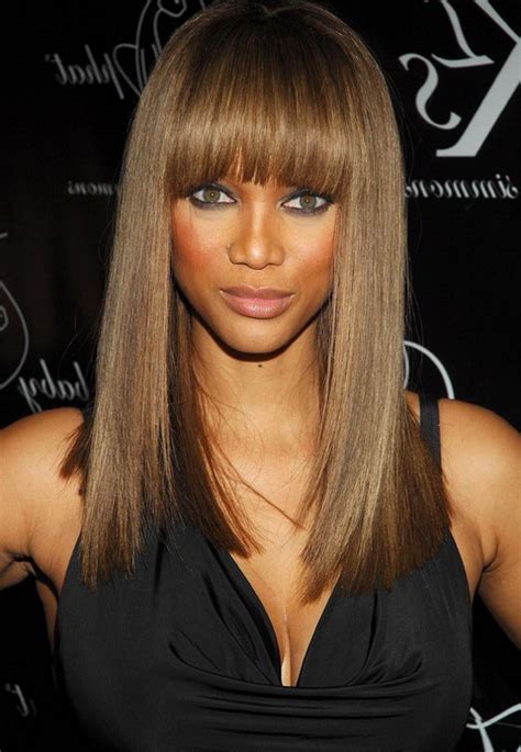 Tyra Banks' Long Hairstyle: Straight Hairstyle with Blunt Bangs for ...