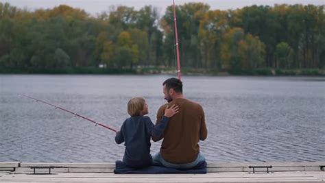 Dad Encourages His Son On Fishing Stock Footage Video 100 Royalty