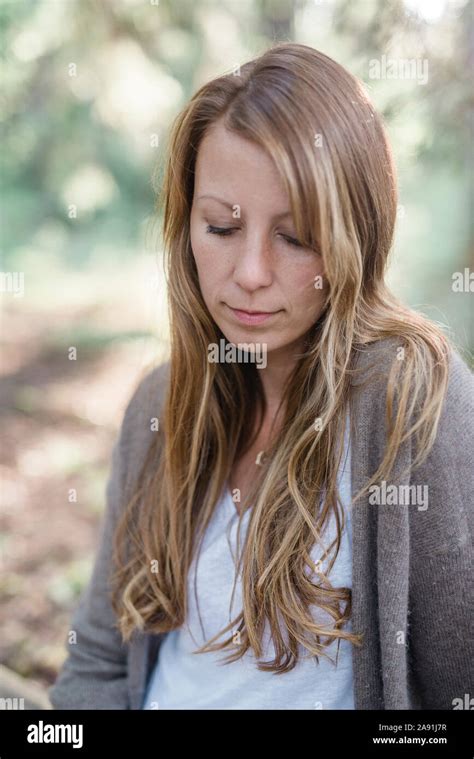 Woman Looking Down Stock Photo Alamy