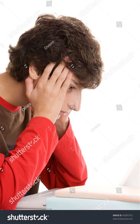 Portrait Of Young Dejected Man Sitting Behind Desk Stock Photo 45391912