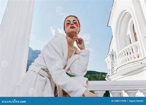 Sensual And Beautiful Woman Stands On The Balcony Of The Hotel Unaltered Stock Photo Image Of