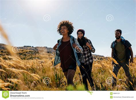 Group Of Friends On Walk Through Countryside Stock Image Image Of