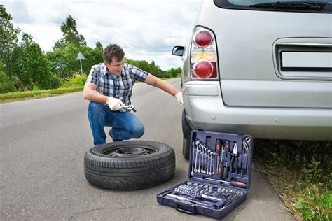 Man Changing Wheel Of Car Stock Photo By Ryzhov