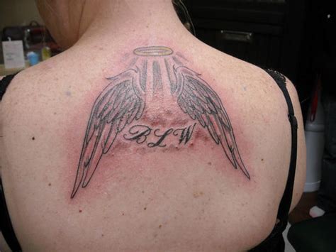 Angel Halo And Wings Tattoo Pictures Of Angel Wings Tattoo Designs