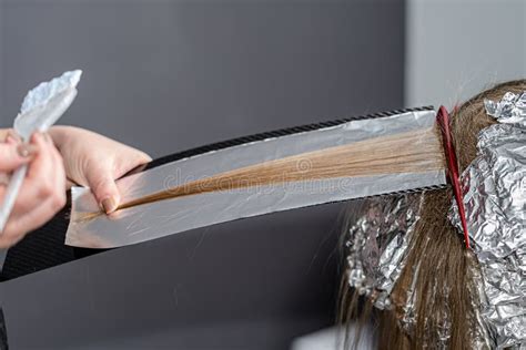 Set Of Hair Bleaching Process Hair Stylist Using Purple Shampoo After Hair Lightening Stock