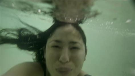 Woman Swimming Underwater In Pool Stock Video Footage