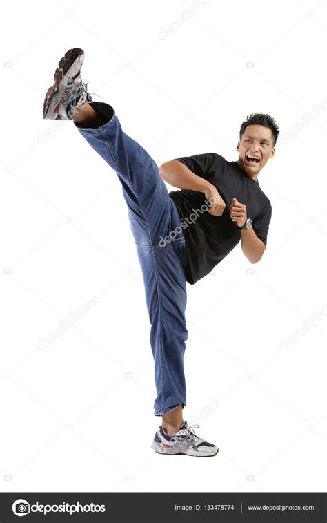 Young man kicking — Stock Photo © MicrostockAsia #133478774