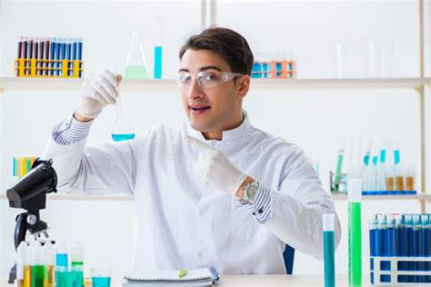 The Young Chemist Student Working In Lab On Chemicals Stock Image