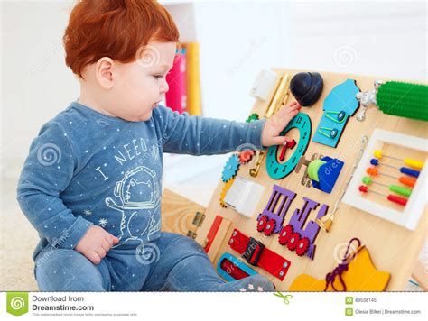 Cute Toddler Baby Playing With Busy Board At Home Stock Image Image