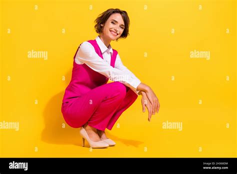 Portrait Of Attractive Cheerful Chic Classy Girl Sitting Posing Good Mood Isolated Over Bright