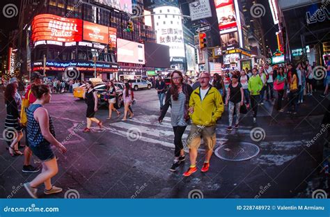 People In Intersection Of Times Square New York City Editorial