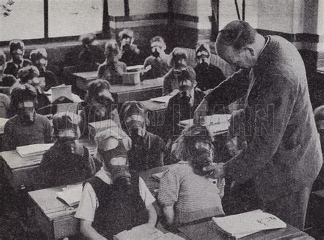 British Schoolchildren Practicing Putting On Their Gas Masks Stock