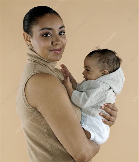 Mother Holding Her Baby Stock Image F001 1789 Science Photo Library