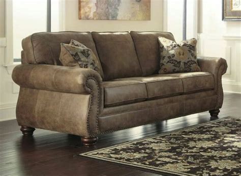 A quick flip of the back turns this sofa into a bed for your guests. Pin by Mz Furniture Official on mz furniture | Faux leather sofa, Ashley leather sofa, Leather ...