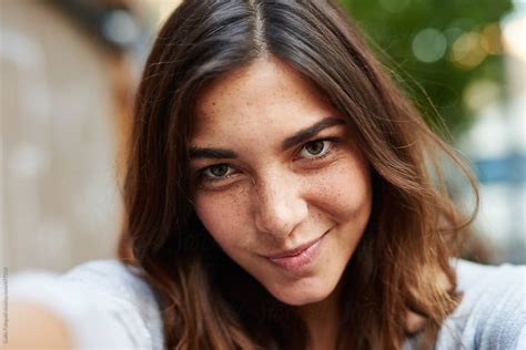 Cute Girl Smiling At Camera Making Selfie By Stocksy Contributor Guille Faingold Stocksy