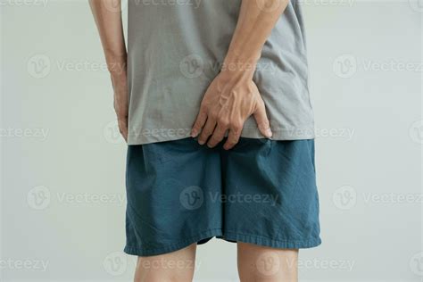 Male Hand Holding Her Bottom Because Having Abdominal Pain And Hemorrhoids Health Care