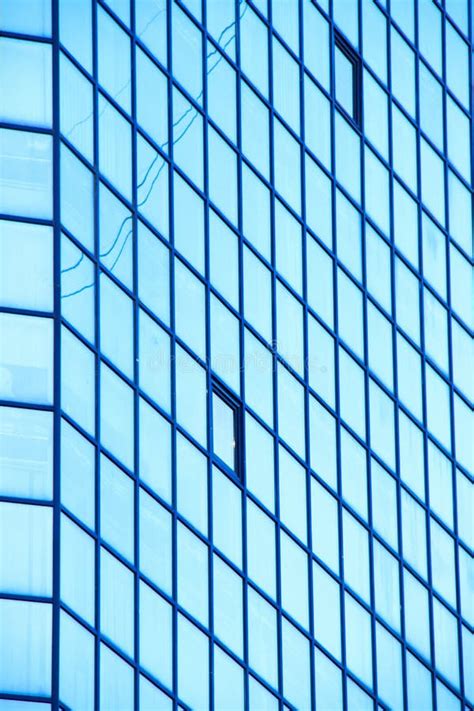 A High Rise Office Building With Blue Glass Windows Stock Photo Image