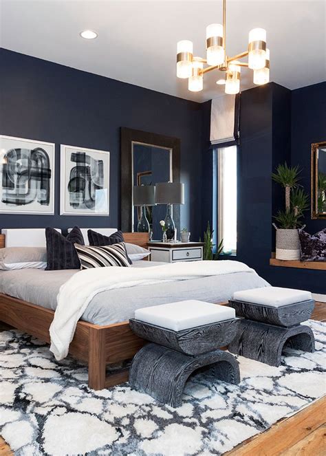 From modern to classic, find a blue color scheme that's a perfect match. This master bedroom has modern art, a dark wall color, a ...