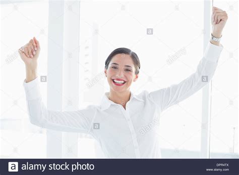 Business Woman With Clenched Fists At Office Stock Photo Alamy