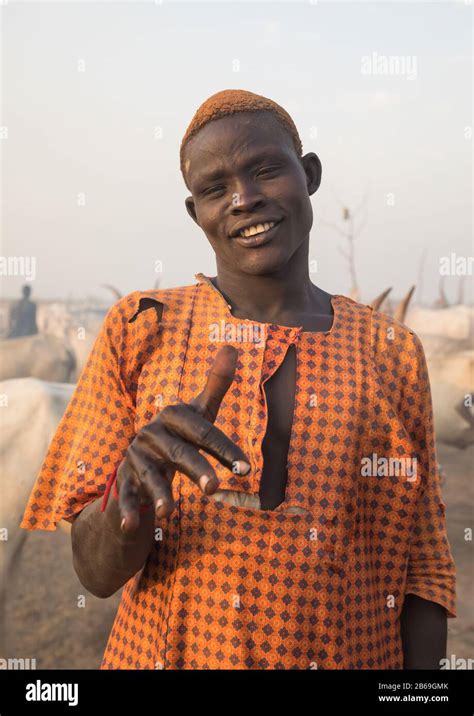 Portrait Of A Mundari Tribe Man With Hair Dyed In Orange With Cow Urine