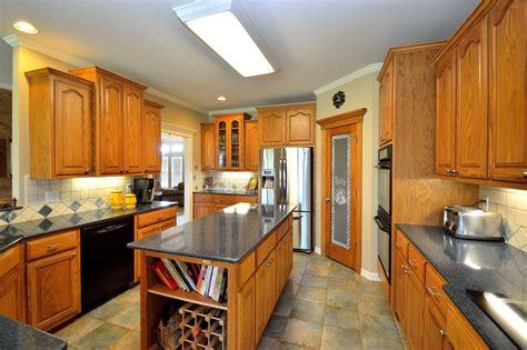 To refresh or update the cabinets during your. The highly functional kitchen is beautiful with an abundance of rich oak cabinets adorned with ...